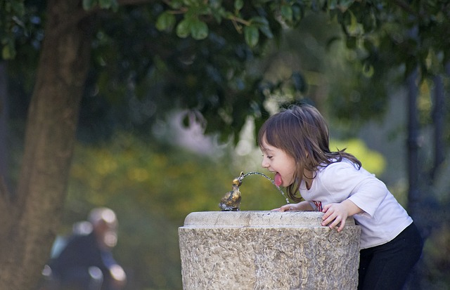 Child at water fountain